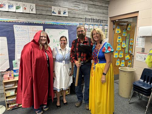  Superintendent Snowberger is dressed like the character Paul Bunyan in a classroom