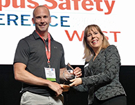  Mike Newton accepts the K-12 Campus K-12 Security Director of the Year Award from Robin Hattersley