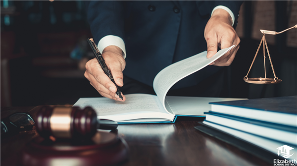  A stock photo of man in suit going through papers