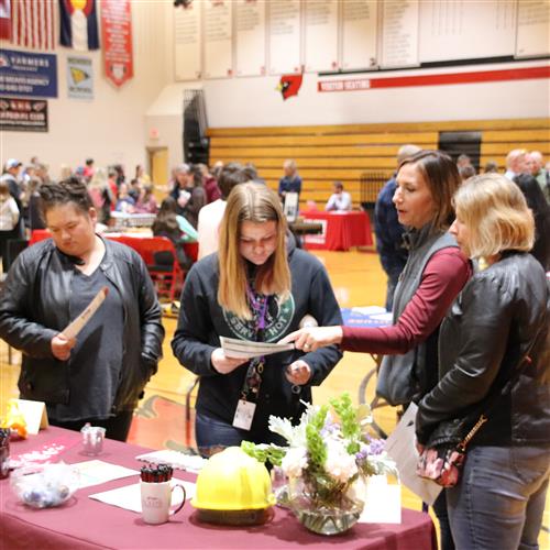 A Pickens Technical College rep speaks with a family